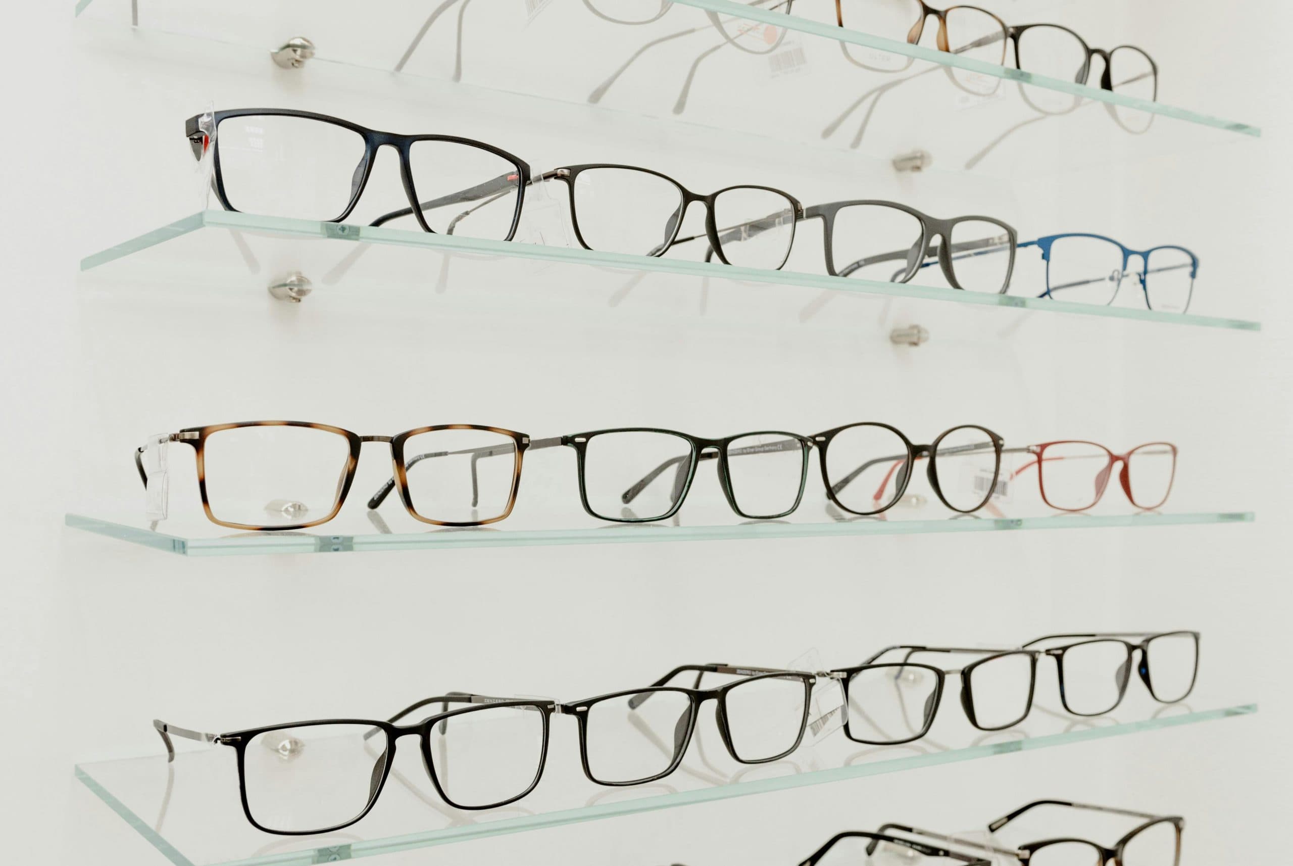 Eyeglass frames displayed on shelves at Mill Creek Family Eyewear