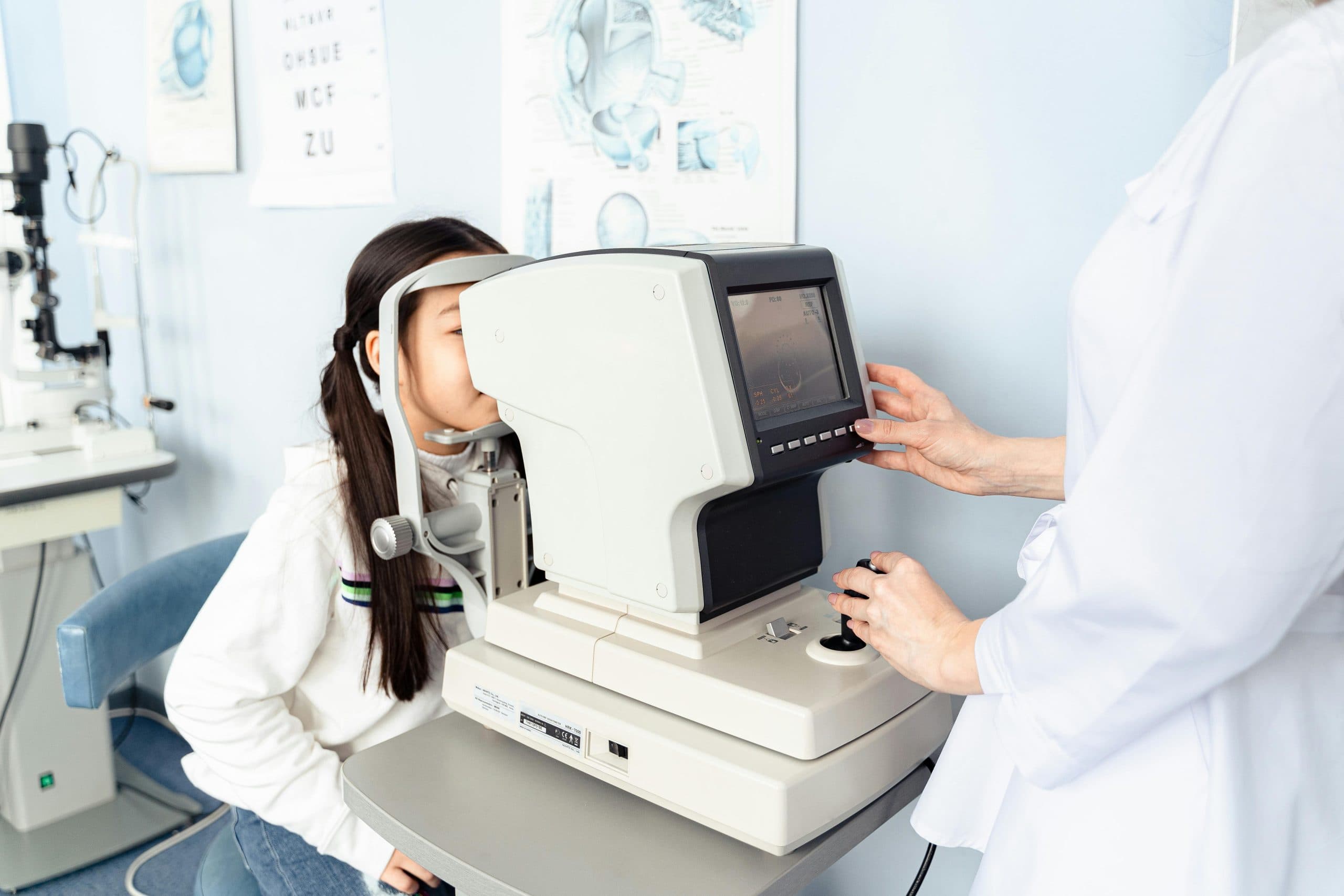 Child having an eye exam for myopia management at Mill Creek Family Eye Center